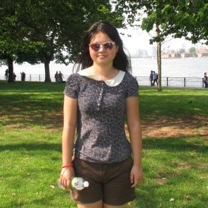 Chenglu Liang standing on grass in a park